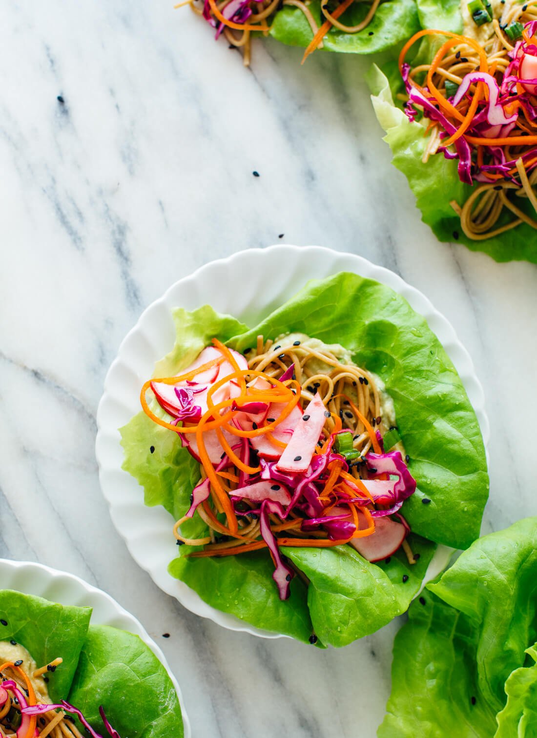 These healthy lettuce wraps are colorful, fun to eat, and so delicious! They're vegetarian/vegan, and easily gluten free. Get the recipe at cookieandkate.com
