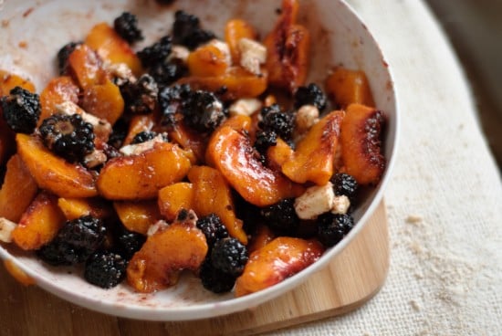 blackberry peach galette filling with raw sugar, butter and honey