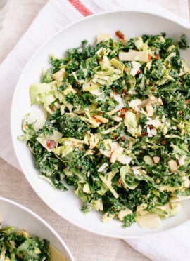 Raw kale and brussels sprouts salad with tahini-maple dressing