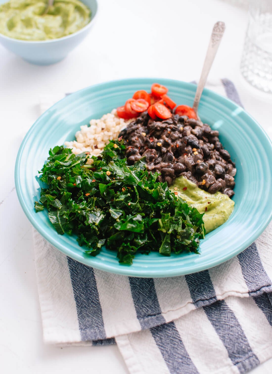 Kale black bean burrito bowls make a delicious, redeeming, vegan dinner that packs well for tomorrow's lunch. cookieandkate.com