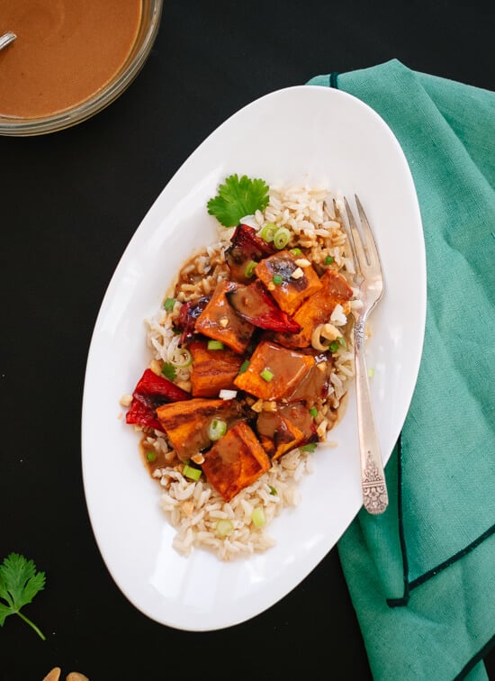 Spicy Thai Peanut Sauce over Roasted Sweet Potatoes and Rice - cookieandkate.com
