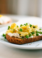 Scrambled eggs and goat cheese on toast with fresh peas and dill - cookieandkate.com