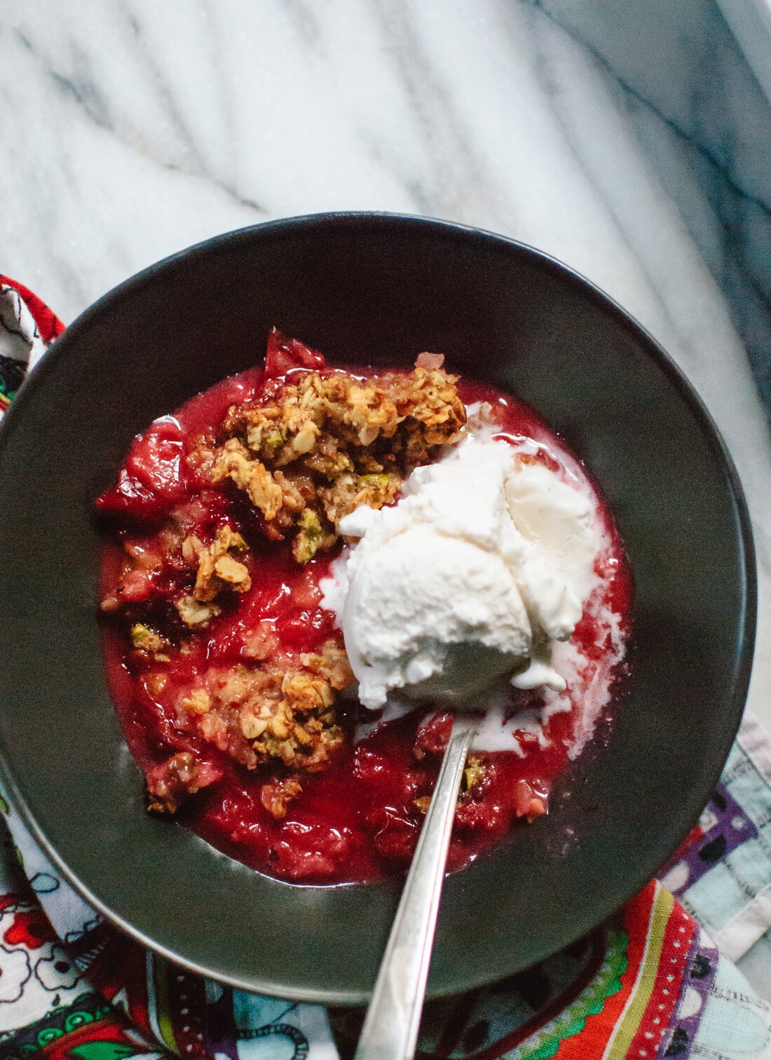Simple, gluten-free plum crisp with a pistachio, oat and almond meal topping