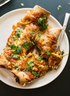 spinach artichoke enchiladas with a simple homemade red sauce