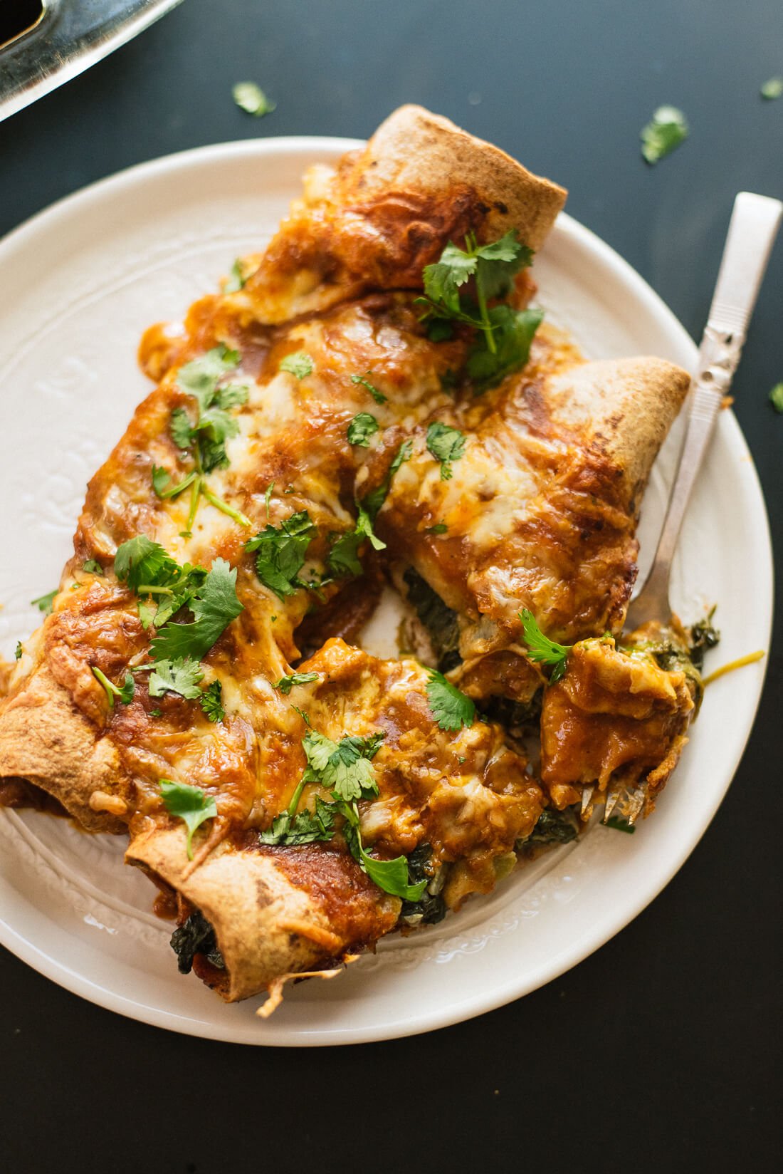 spinach artichoke enchiladas with a simple homemade red sauce