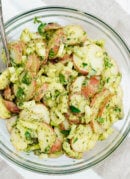 This simple, herbed red potato salad recipe will be a hit at your next potluck! cookieandkate.com
