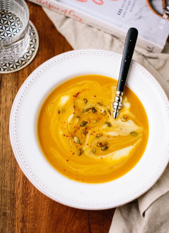This spicy squash soup recipe from The Year of Cozy is easy to make and full of flavor! cookieandkate.com