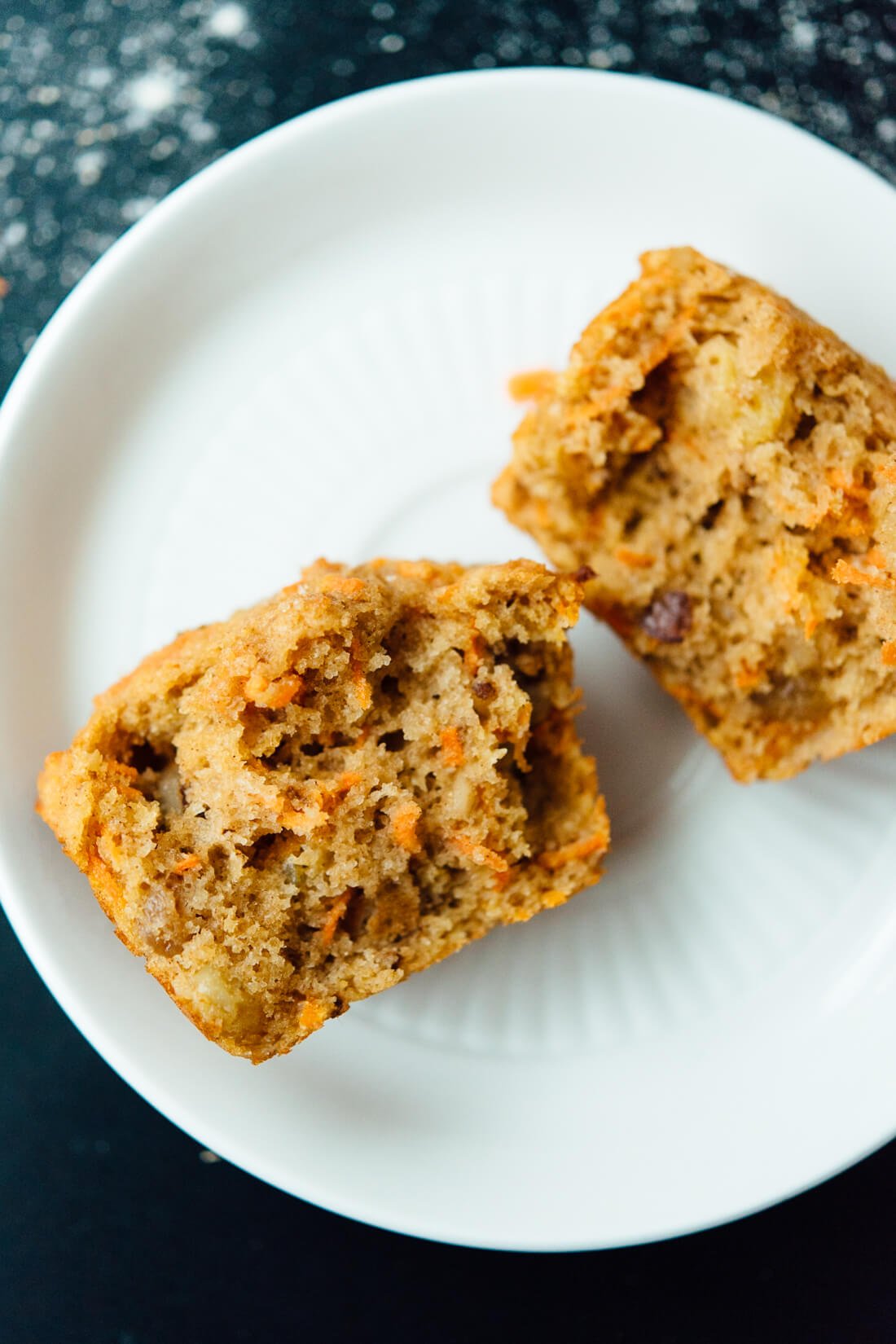 Healthy carrot muffin halves on a plate
