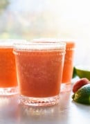Super refreshing frozen strawberry margaritas, made with all-natural ingredients! Ready in 10 minutes. cookieandkate.com