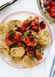 This simple Greek bruschetta recipe is ready in 15 minutes! Recipe from Minimalist Baker's new cookbook, Everyday Cooking. cookieandkate.com
