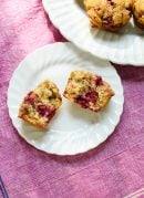 Amazing healthy raspberry muffins made with whole wheat flour, honey and frozen raspberries! cookieandkate.com