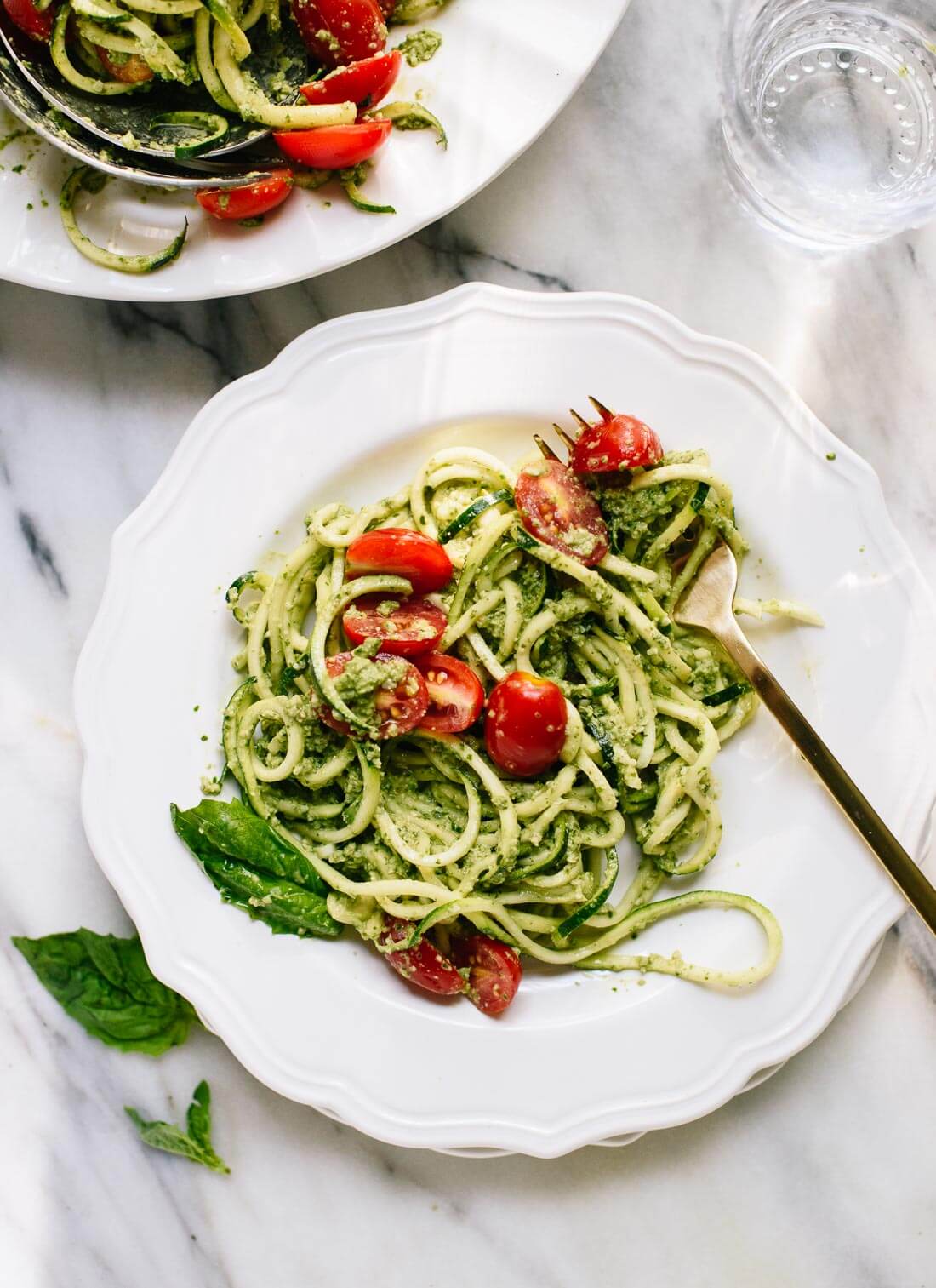 Delicious zucchini noodles (zoodles) with pesto and tomatoes - cookieandkate.com