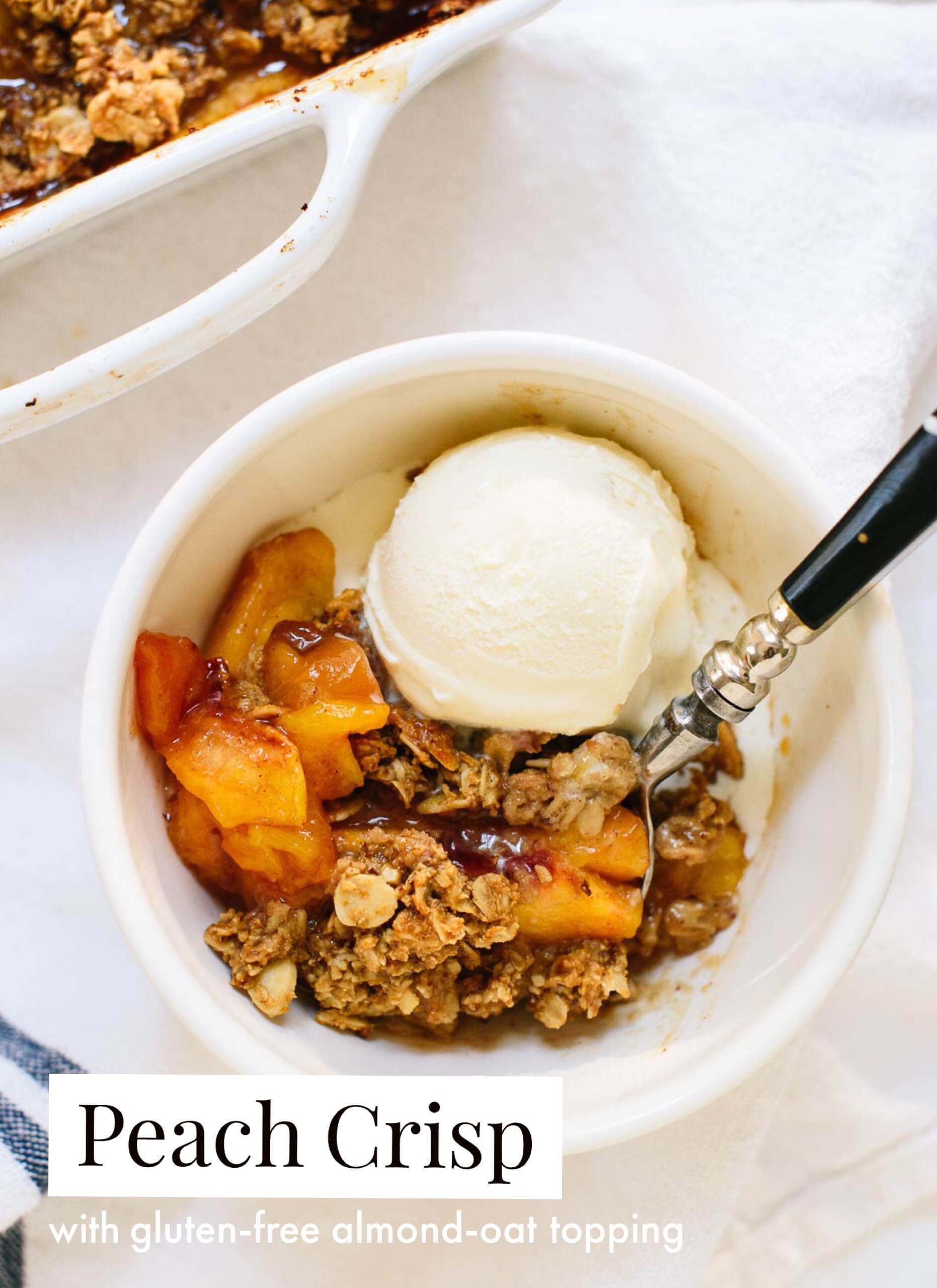 This peach crisp recipe is made with ripe summer peaches, and topped with gluten-free almond-oat topping. Delicious! cookieandkate.com