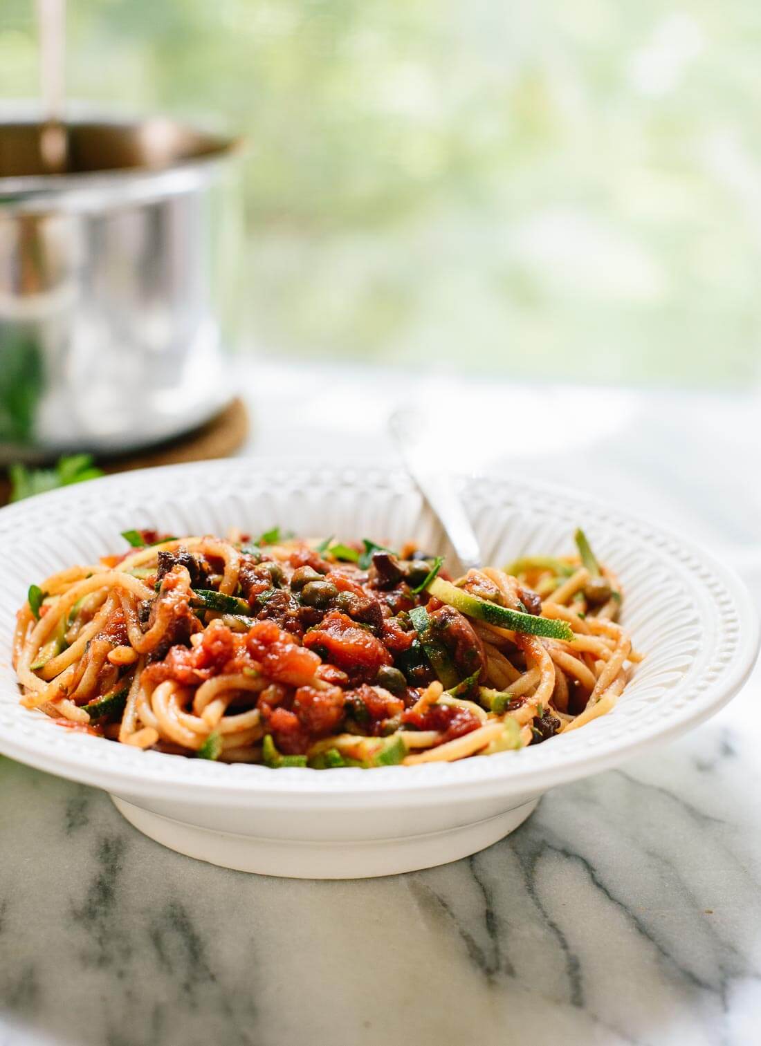 Learn how to make spaghetti alla puttanesca, perfect for easy weeknight dinners! cookieandkate.com