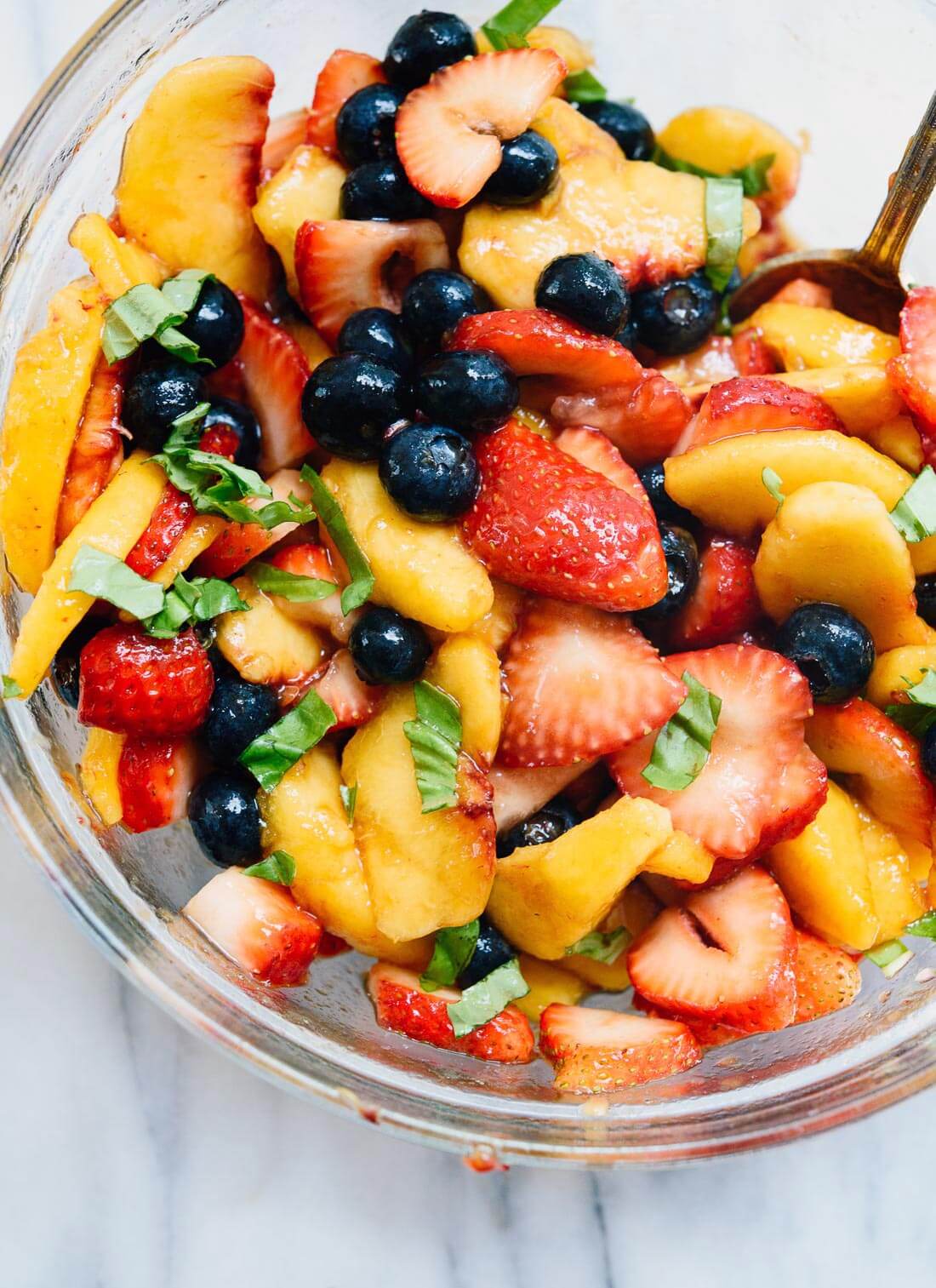 Take advantage of ripe summer fruit to make this simple summer fruit salad! Peaches, strawberries, blueberries, and balsamic vinegar make the best fruit salad. cookieandkate.com