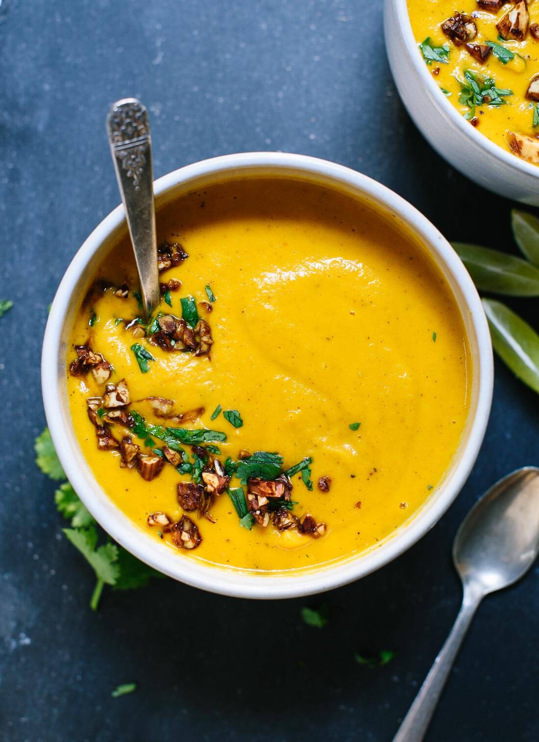 This creamy, Thai carrot and sweet potato soup will warm you up on cold days. It's filling and full of nutritious ingredients. cookieandkate.com