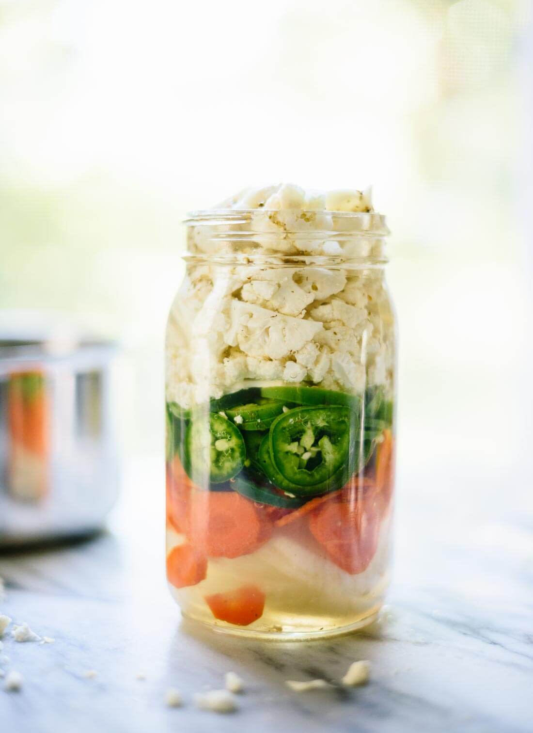 Learn how to make spicy quick-pickled vegetables! This recipe is easy to make. Pickled veggies are great on salads, sandwiches and other dishes. cookieandkate.com
