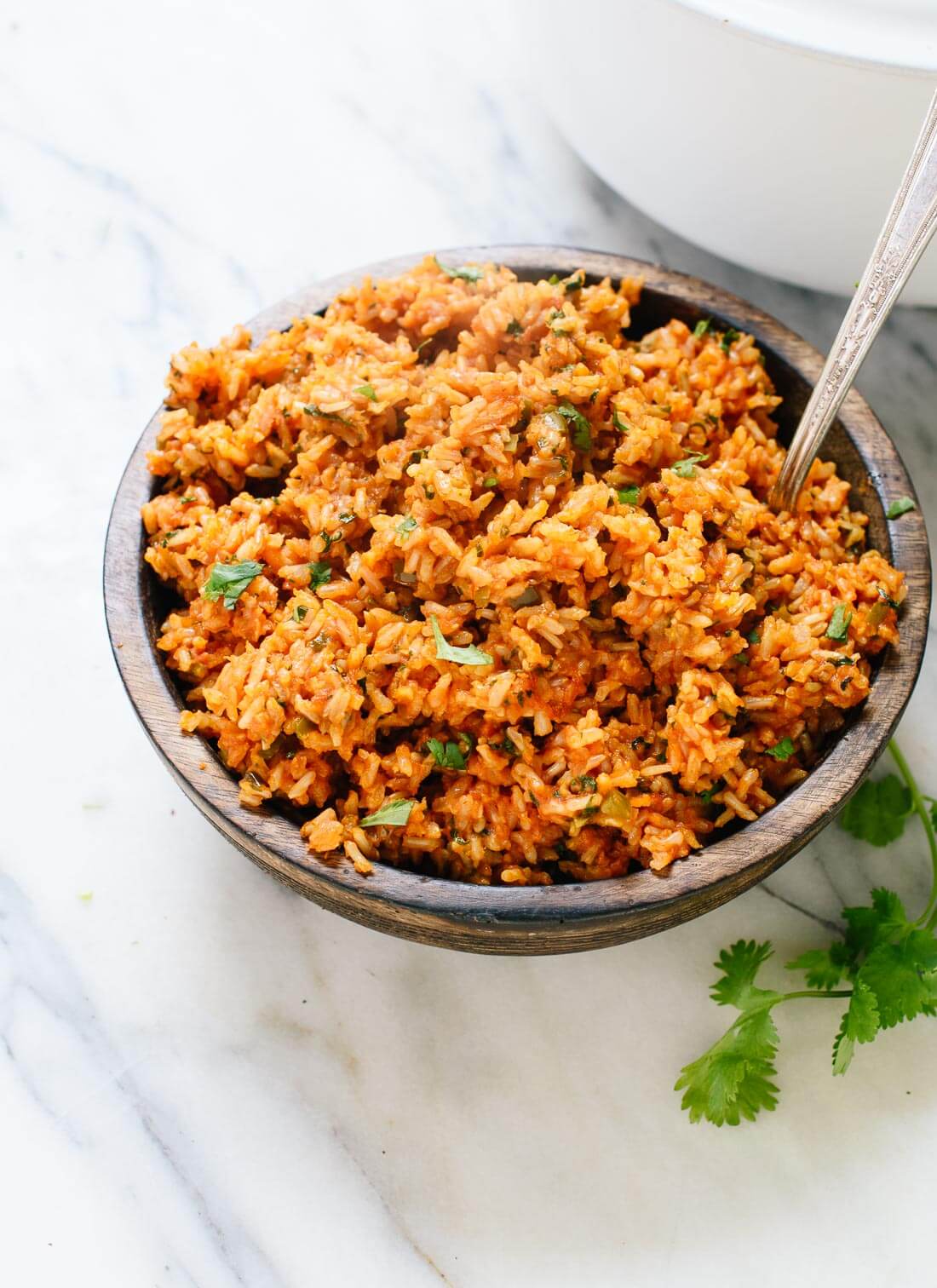 Amazing Mexican brown rice - tastes just like your favorite Mexican restaurant's rice, but made healthier! cookieandkate.com