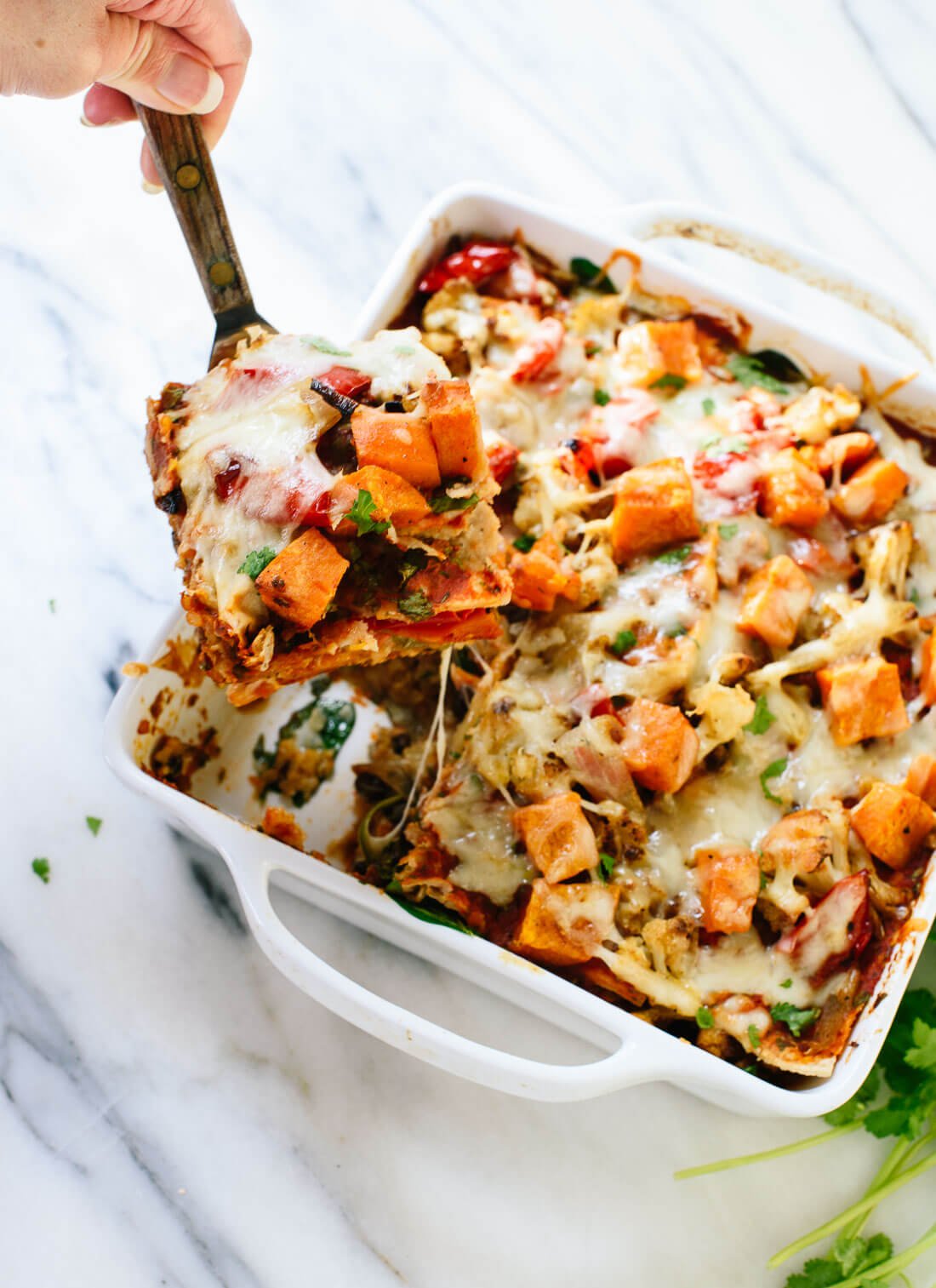 This enchilada casserole recipe is a hearty, veggie-packed dinner loaded with fresh Mexican flavors! cookieandkate.com