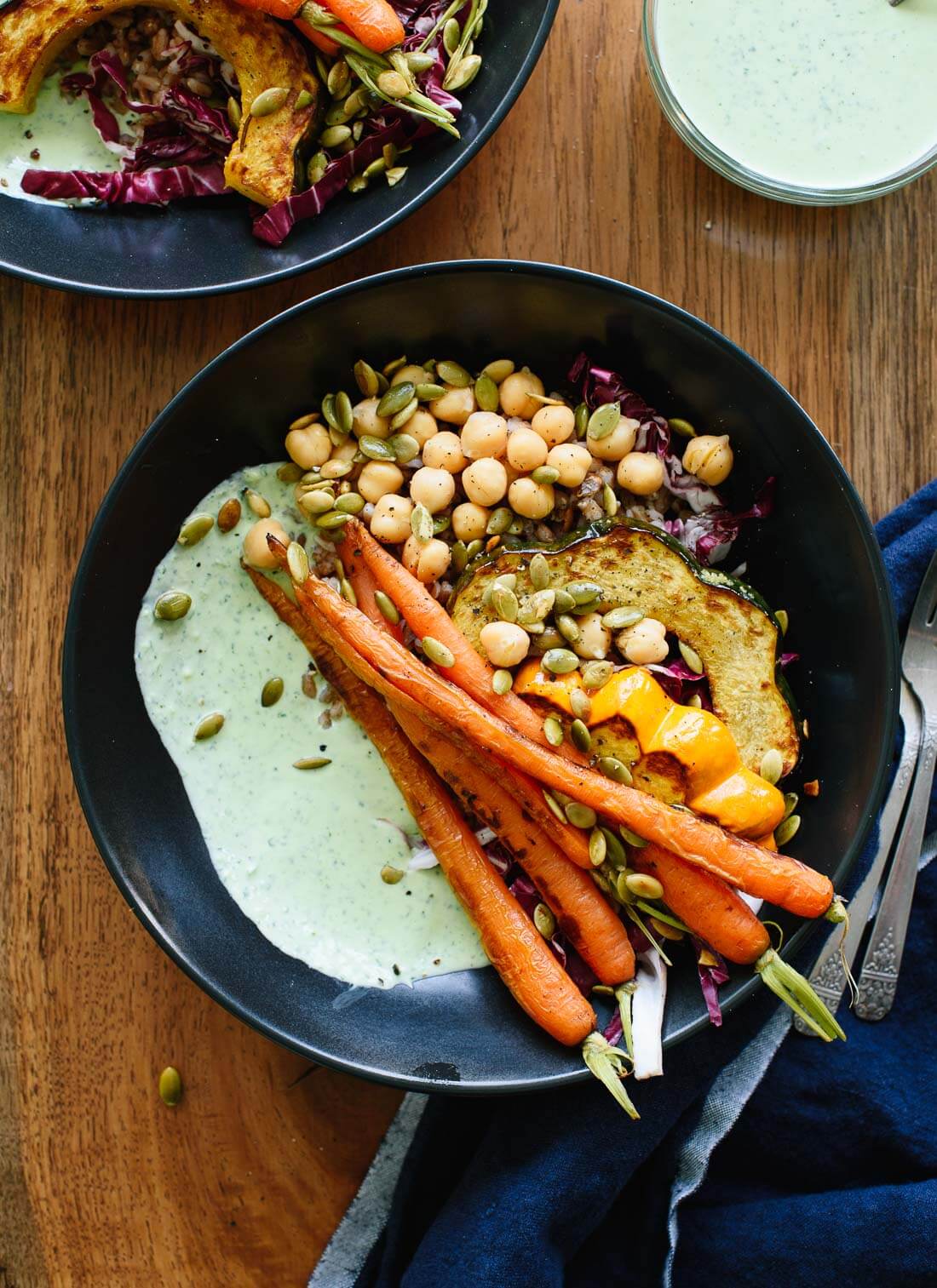 These farmers' market bowls feature roasted veggies, warm whole grains, chickpeas and a creamy yogurt-based green goddess sauce - cookieandkate.com