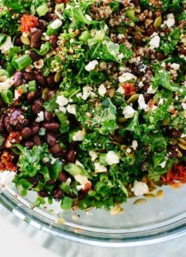 Healthy kale and quinoa salad recipe with Mexican flavors, including black beans, pepitas, and a cumin-lime dressing. Gluten free and easily vegan! cookieandkate.com