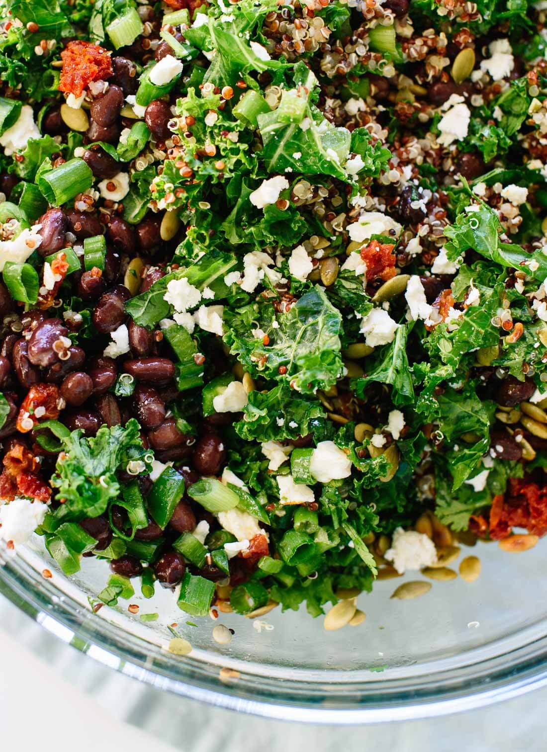 Healthy kale and quinoa salad recipe with Mexican flavors, including black beans, pepitas, and a cumin-lime dressing. Gluten free and easily vegan! cookieandkate.com