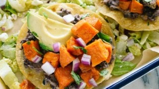 These delicious sweet potato tostadas make a great meatless dinner! Vegetarian, gluten free, and easily vegan.