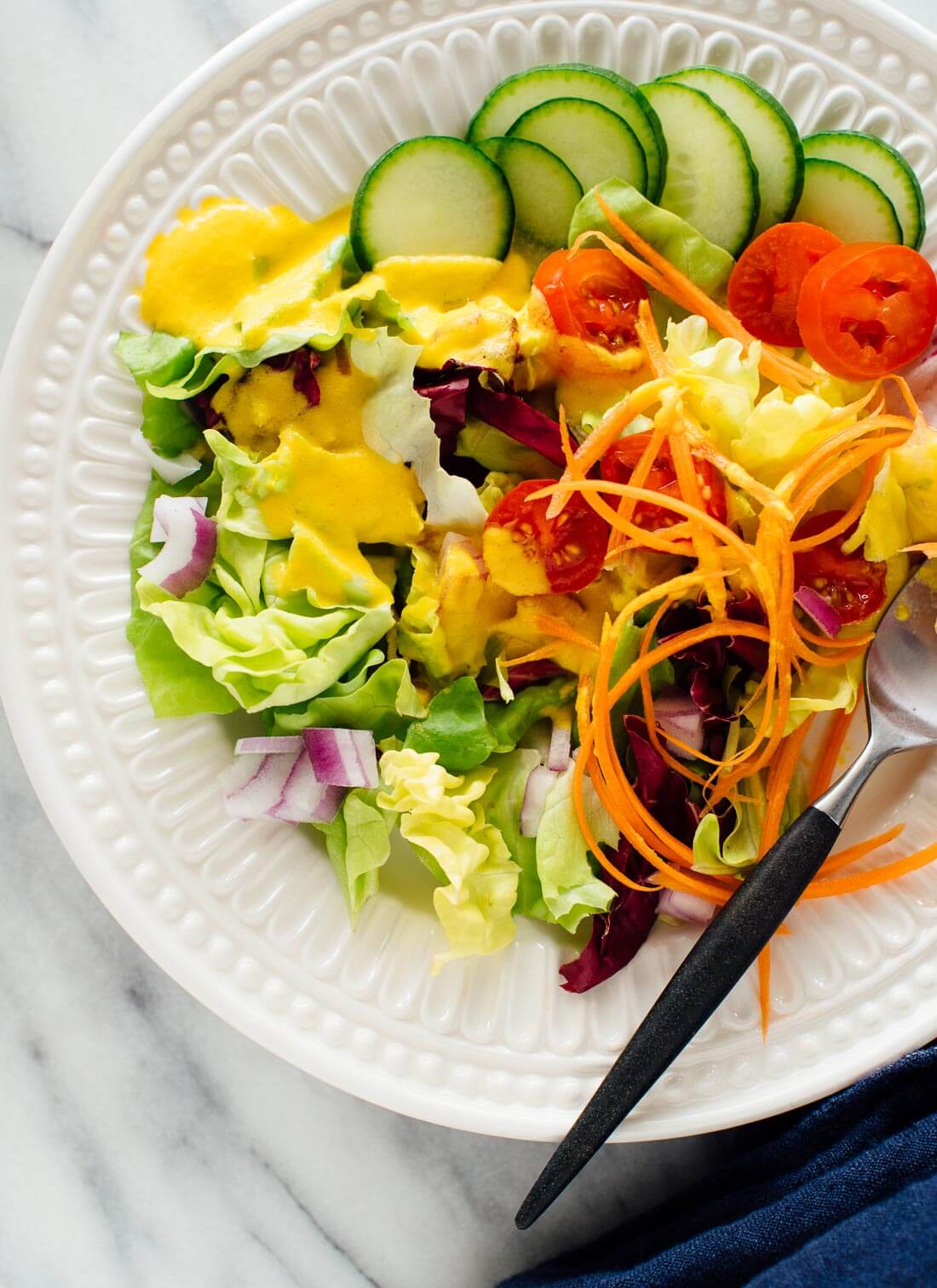 Side salad featuring homemade carrot-ginger dressing, perfect for springtime!