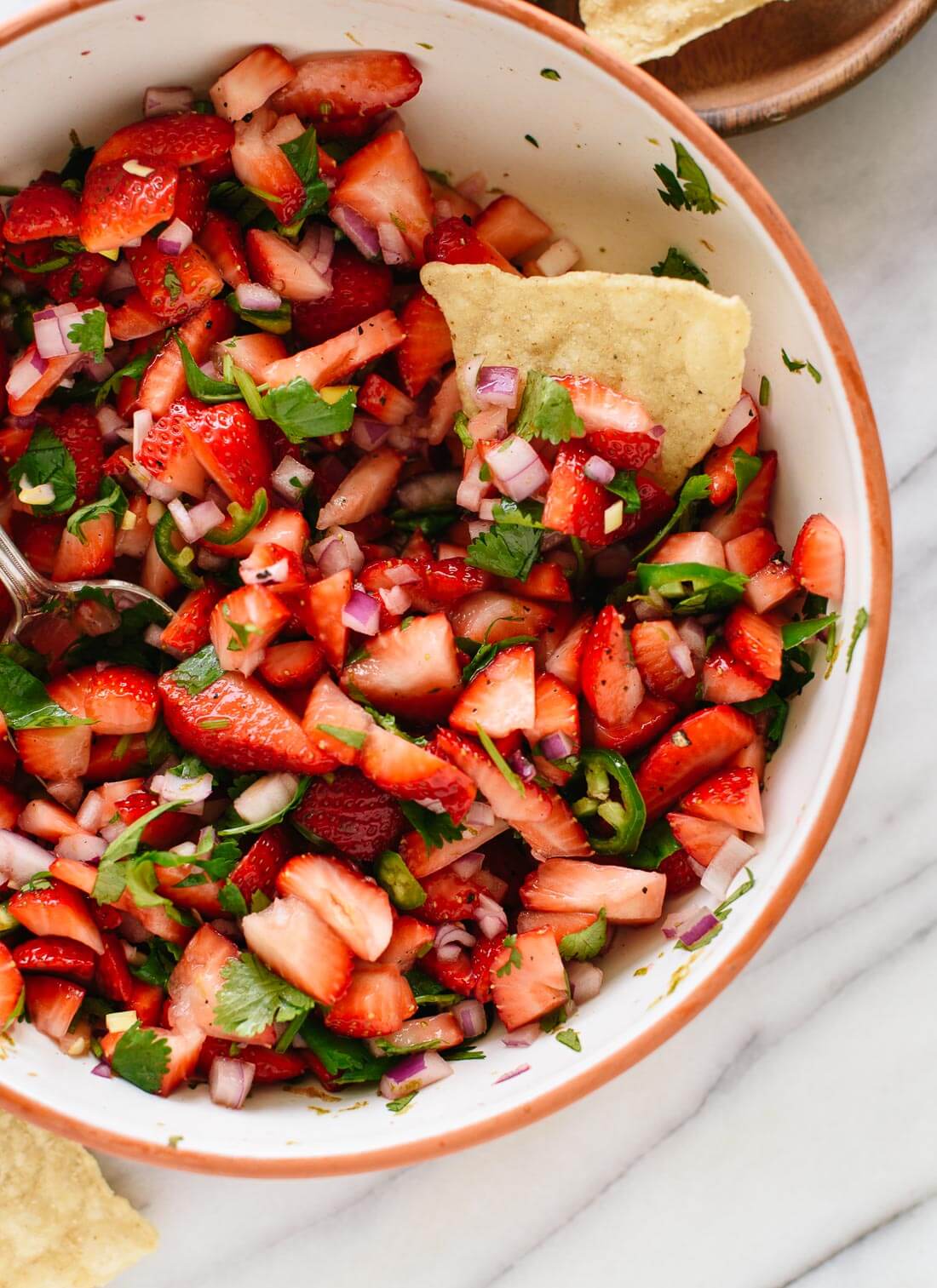 Strawberry salsa makes a delicious springtime party snack! Recipe from Dishing Up the Dirt cookbook - cookieandkate.com