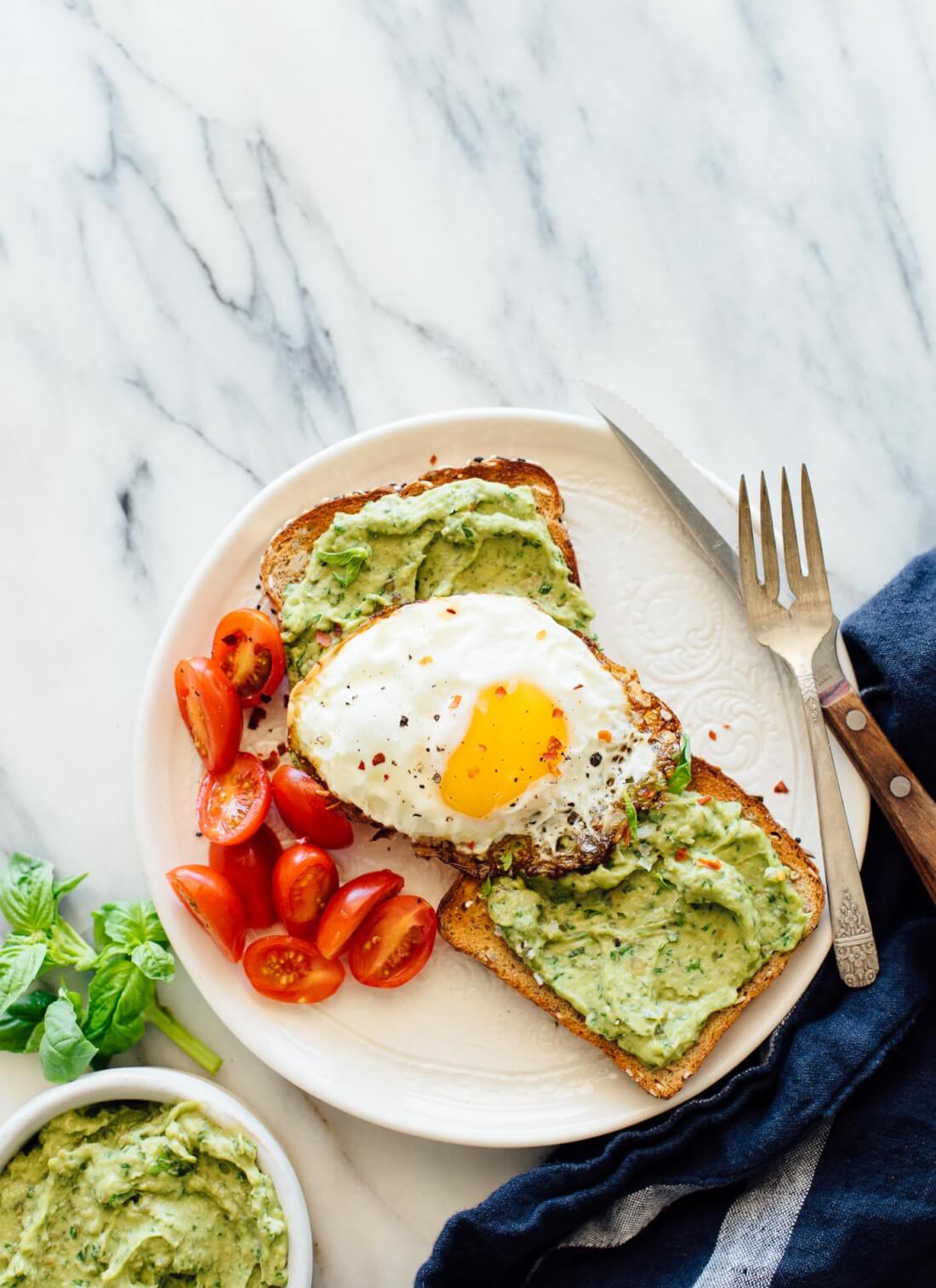 This avocado pesto toast recipe is fantastic with or without eggs! cookieandkate.com