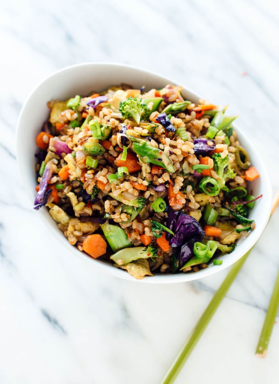 This vegetable fried rice recipe is made with double the vegetables, for flavor and nutrition! Get this vegetarian/gluten free recipe at cookieandkate.com