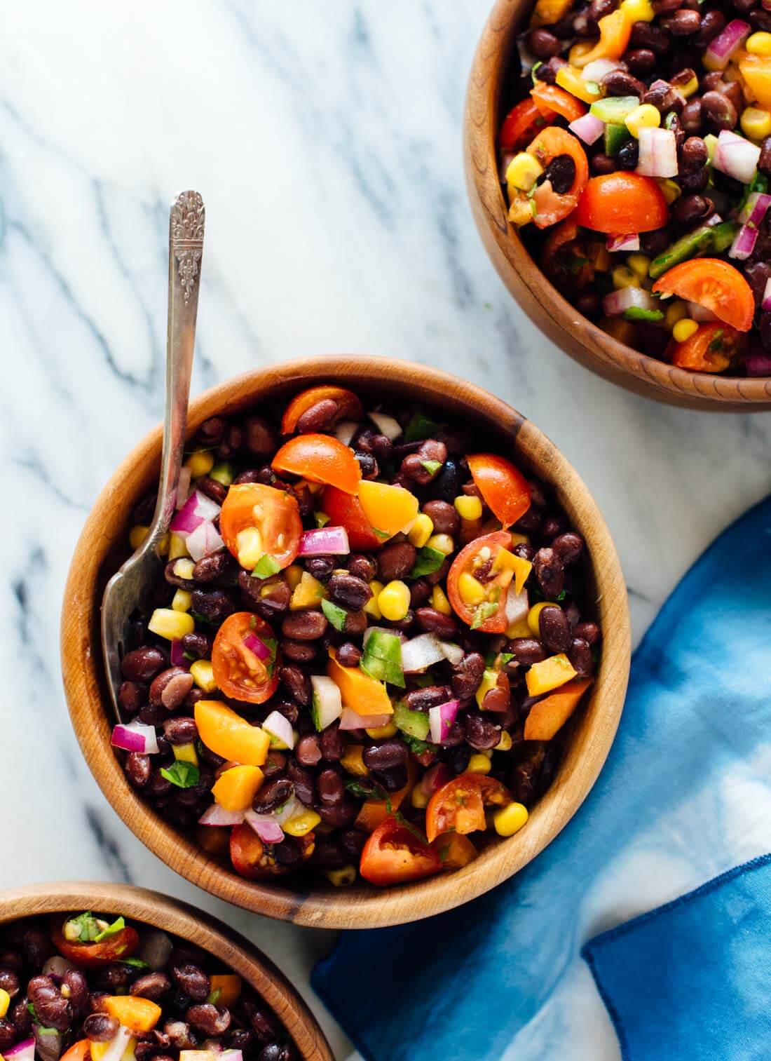 This fresh black bean salad recipe packs great for lunch! It's also perfect for parties and potlucks. Get the recipe at cookieandkate.com