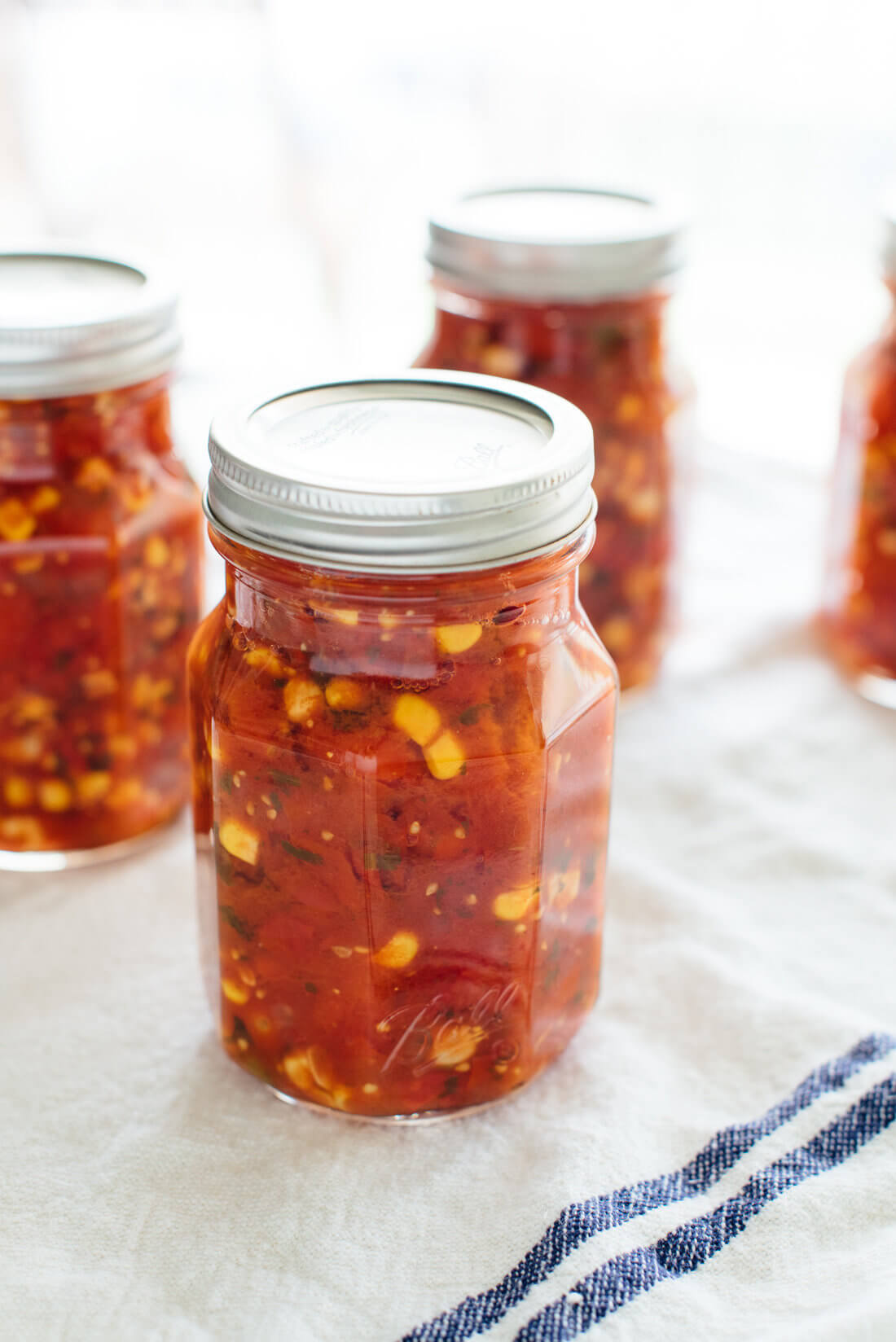 Preserve this cherry tomato and corn salsa now and enjoy it through the winter! Get the recipe at cookieandkate.com