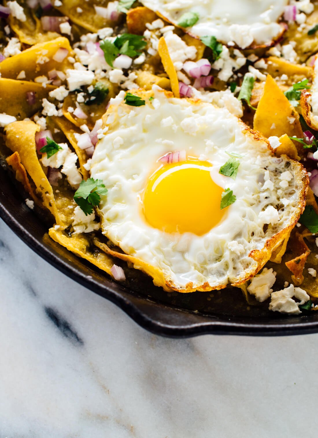 DELICIOUS chilaquiles recipe with salsa verde instead of red sauce! This is a fantastic breakfast, brunch or dinner. cookieandkate.com