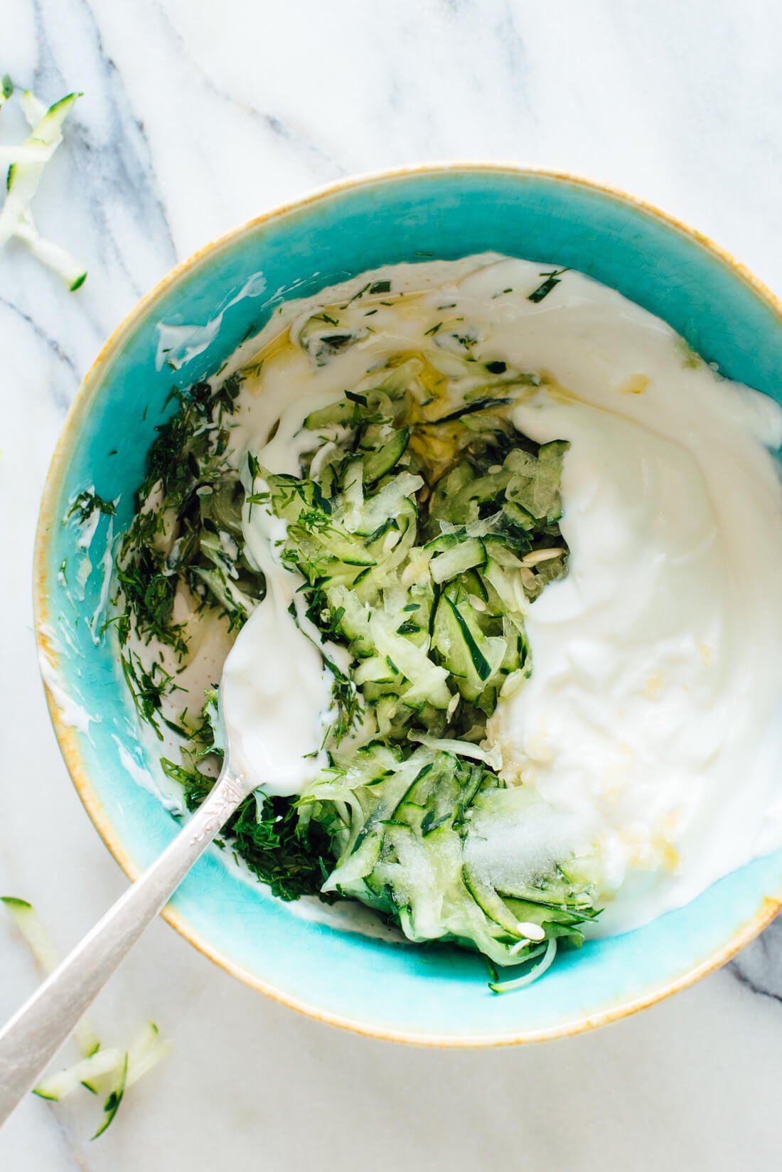 Traditional Greek Tzatziki sauce made with cucumber, yogurt, olive oil, lemon juice, garlic, and fresh dill and mint!