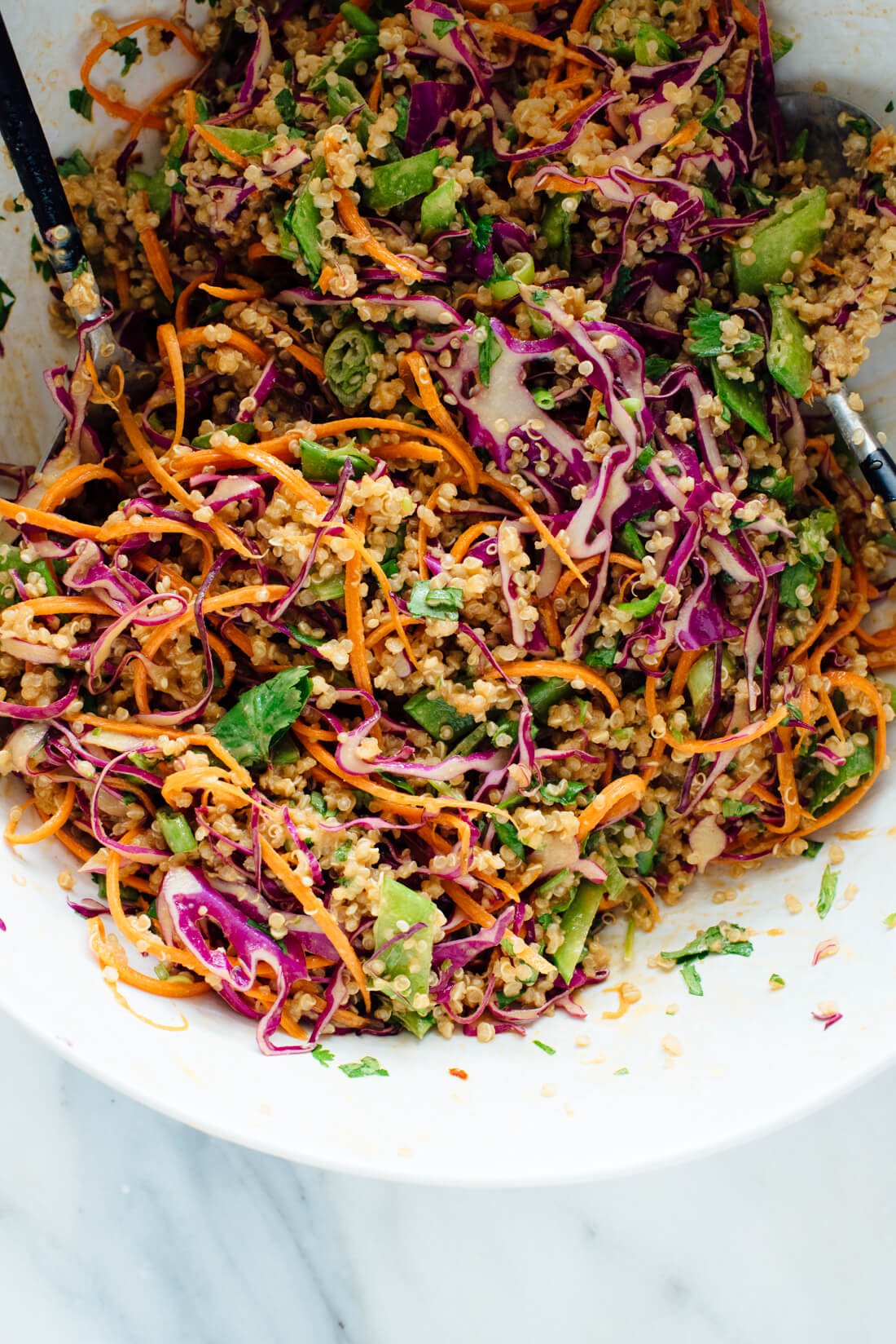 This Thai-flavored quinoa salad recipe is colorful, crisp and delicious! It's also vegan and gluten free. cookieandkate.com