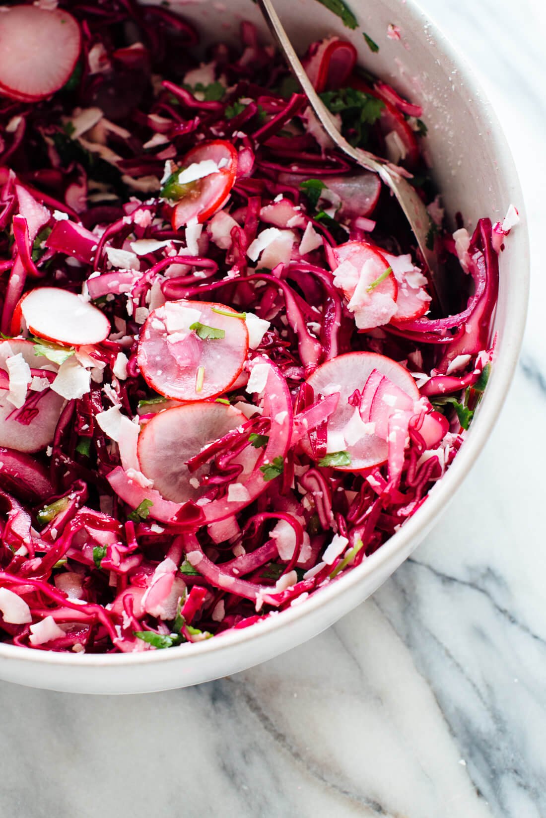 This hot pink slaw is totally irresistible, thanks to—surprise—coconut! If you like coconut, you're going to love this nutrient-dense slaw/side salad. cookieandkate.com