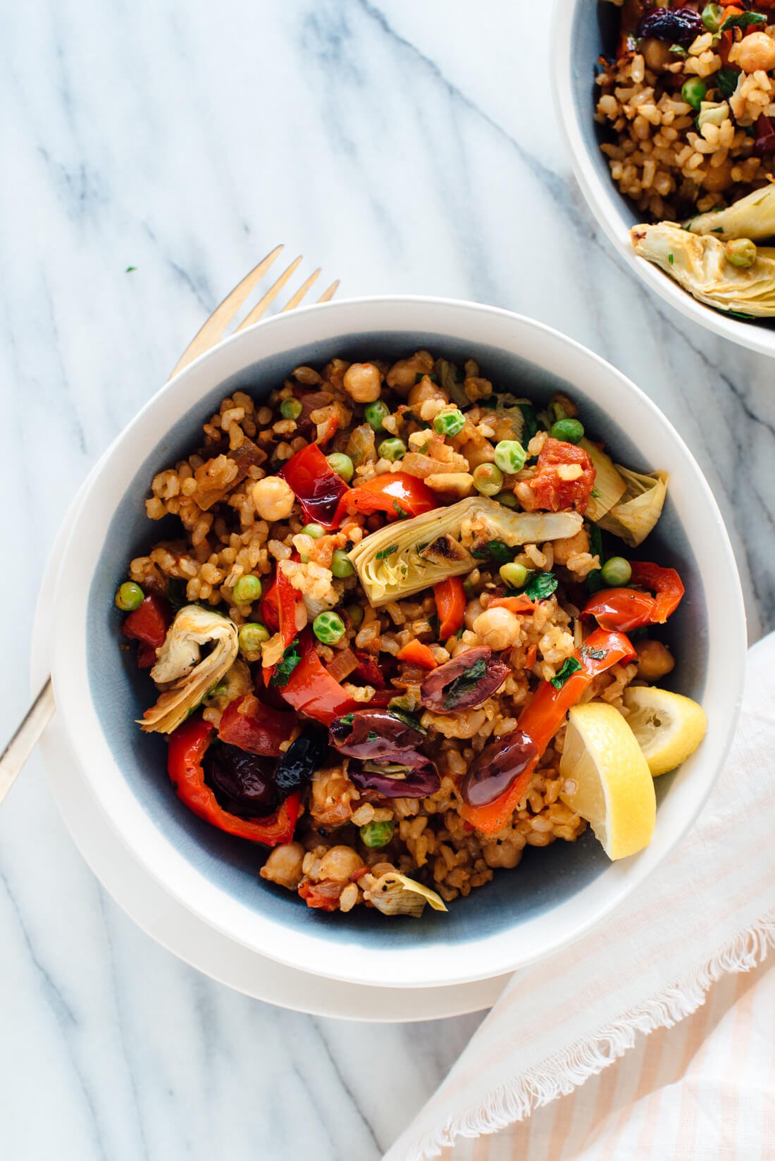 The best vegetable paella recipe! It's loaded with vegetables, chickpeas, and savory spiced rice.
