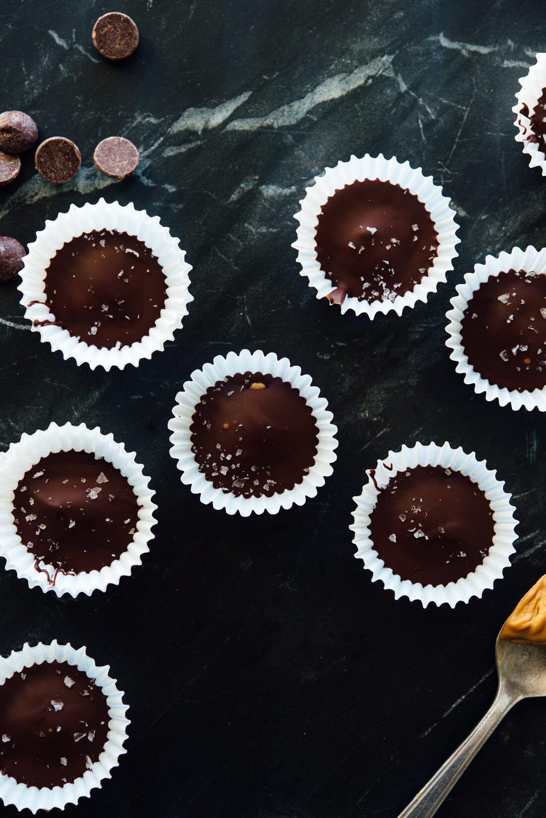 Delicious homemade mini peanut butter cups—this recipe is so easy and only requires 3 ingredients! (Ok, 4 if you want to top them with flaky sea salt, which I recommend.) #Halloween