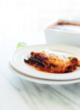 This Italian eggplant Parmesan recipe is lighter than most—it's made with roasted eggplant slices (not fried) and no breading (you won't miss it). #vegetarian