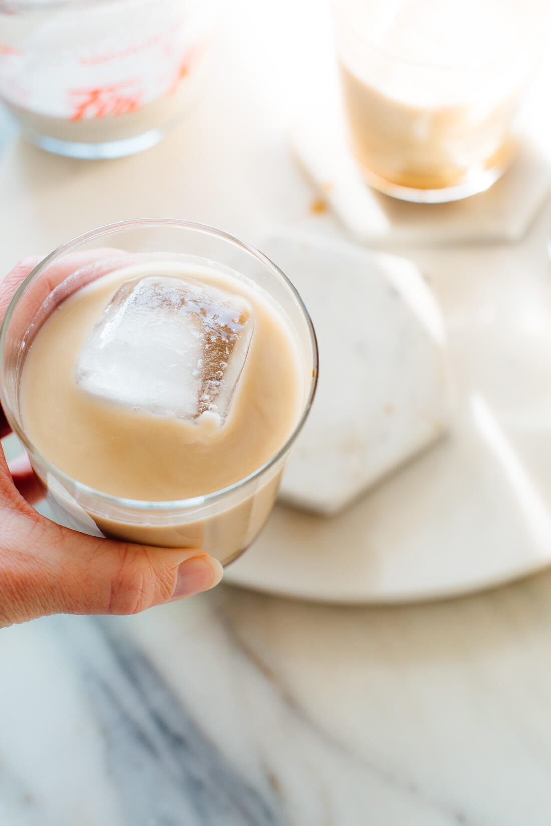 vegan white russian cocktail held in hand