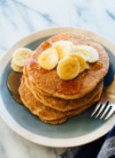 Seriously delicious 100% wheat pancakes recipe! They're naturally sweetened with maple syrup, too.