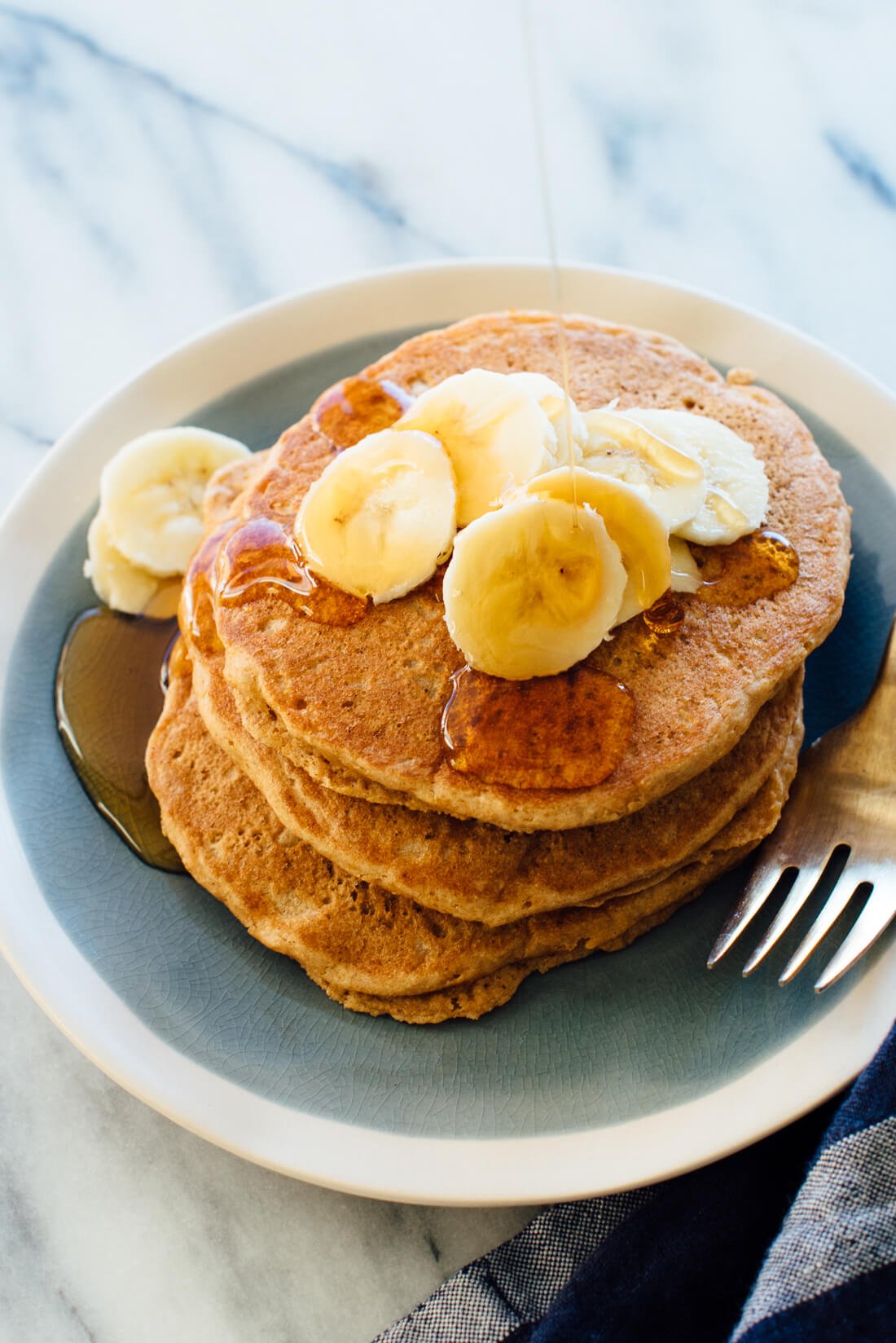 Seriously delicious 100% wheat pancakes recipe! They're naturally sweetened with maple syrup, too.