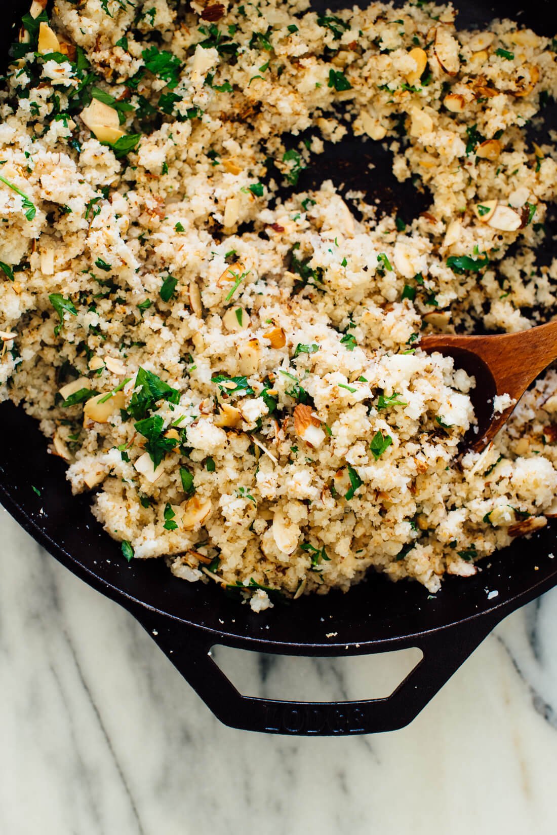 cauliflower rice with toasted almonds, lemon and parsley