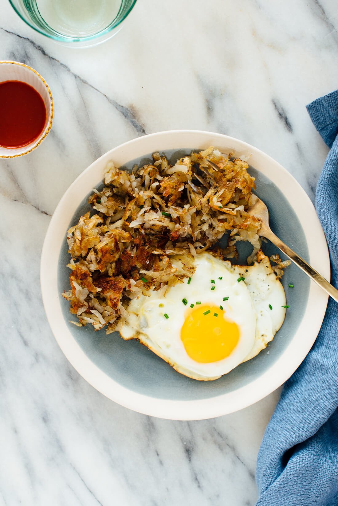 crispy hash browns with egg on plate