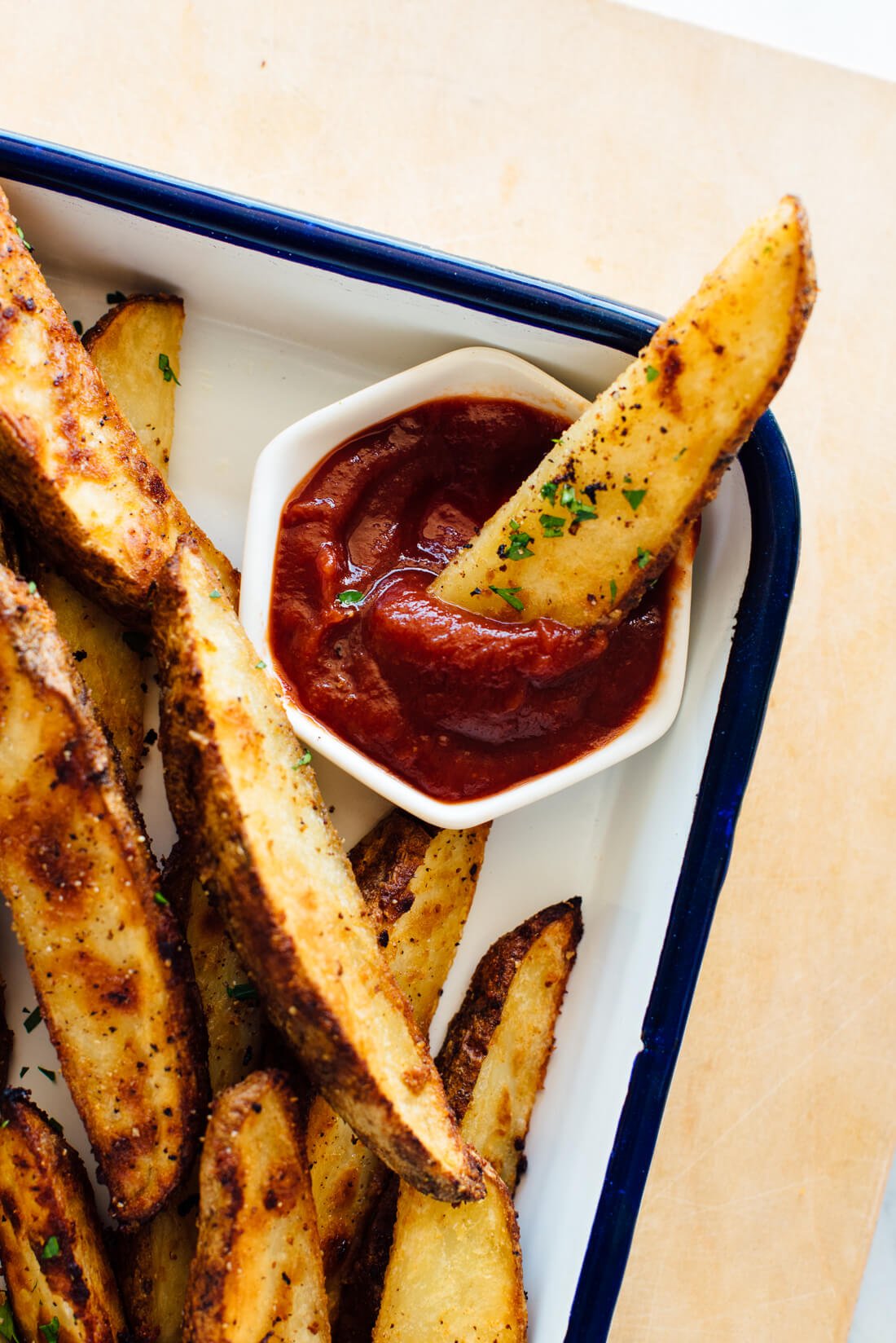 potato wedges with herbs and ketchup