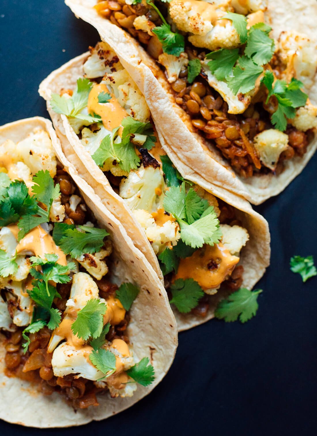 Tacos with roasted cauliflower, seasoned lentils and creamy chipotle sauce