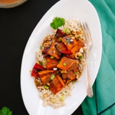 Spicy Thai Peanut Sauce over Roasted Sweet Potatoes and Rice Image