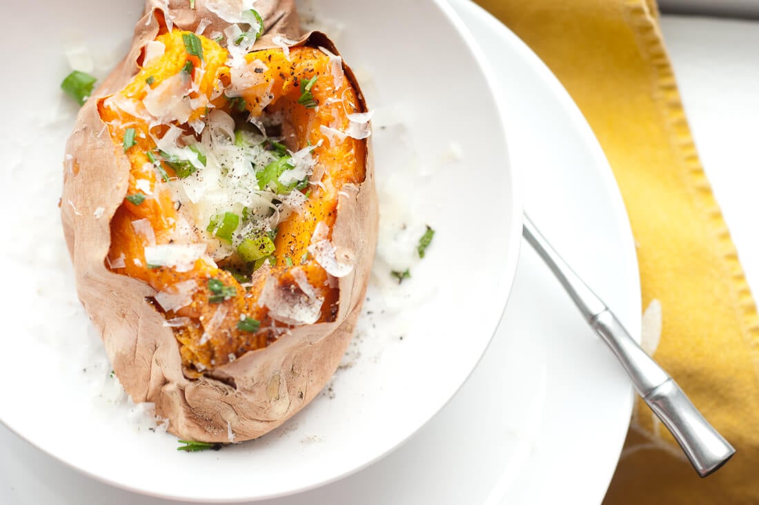 baked sweet potato with fresh rosemary and green onion and parmesan