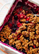 mixed berry crisp with serving spoon